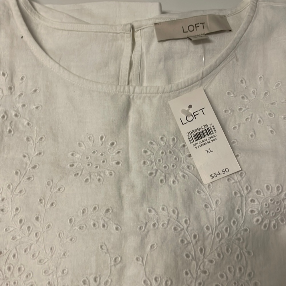 linen blend blouse embroidered details on front and sleeves..55% linen45%viscose